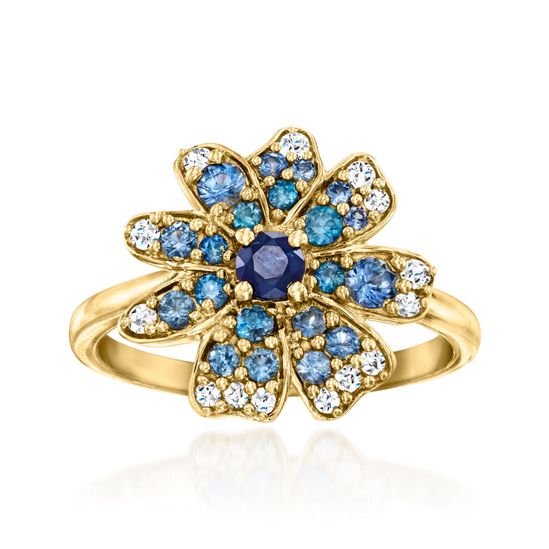 Gold flower ring with blue gemstones and clear white zircon-like stones