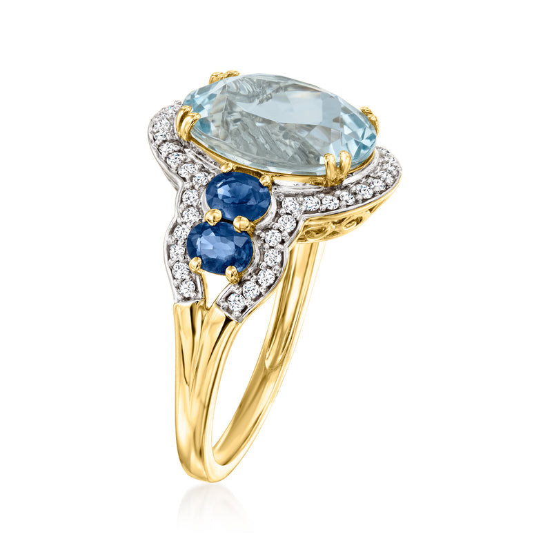 14kt yellow gold ring with oval aquamarine, sapphires, and diamond accents