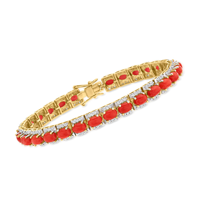Gold-tone tennis bracelet with red coral oval links and diamond-like pave accents