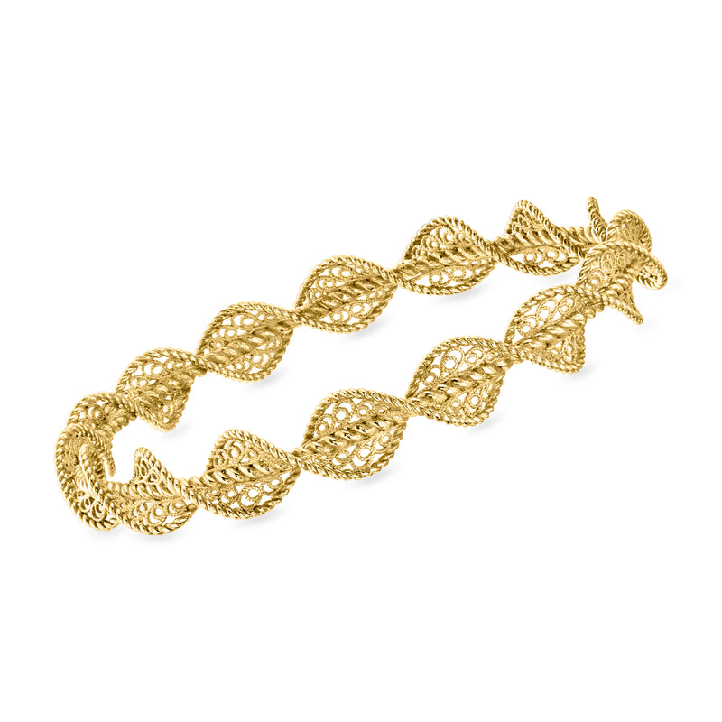 Gold-tone filigree twisted bangle bracelet with ornate braided links