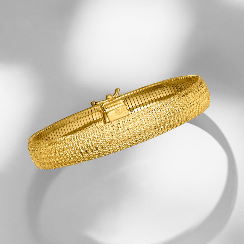 Gold over sterling textured omega-style bracelet with hinged clasp, angled view