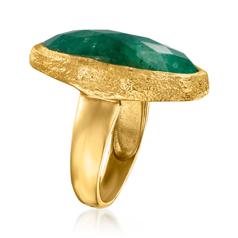 Gold ring with oval emerald-green stone, side profile showing thick bezel setting