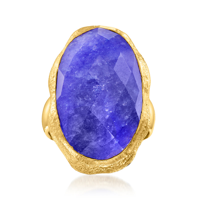 Oval blue simulated sapphire ring with textured gold-tone bezel and split band
