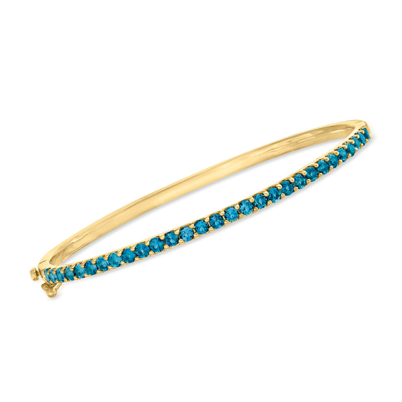 18kt gold over sterling bangle with London blue topaz row of round gemstones