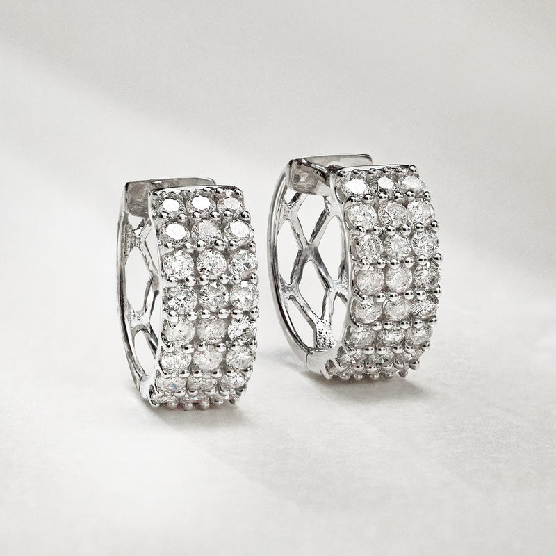 Diamond three-row huggie hoop earrings in 14kt white gold, close-up angle
