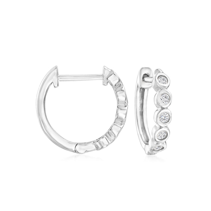 Sterling silver huggie hoop earrings with round bezel-set diamond accents