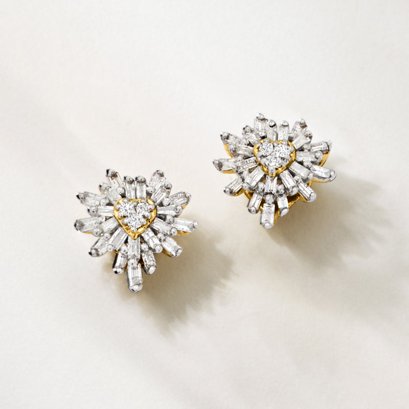 Pair of gold heart diamond stud earrings with radiating burst design and post backs