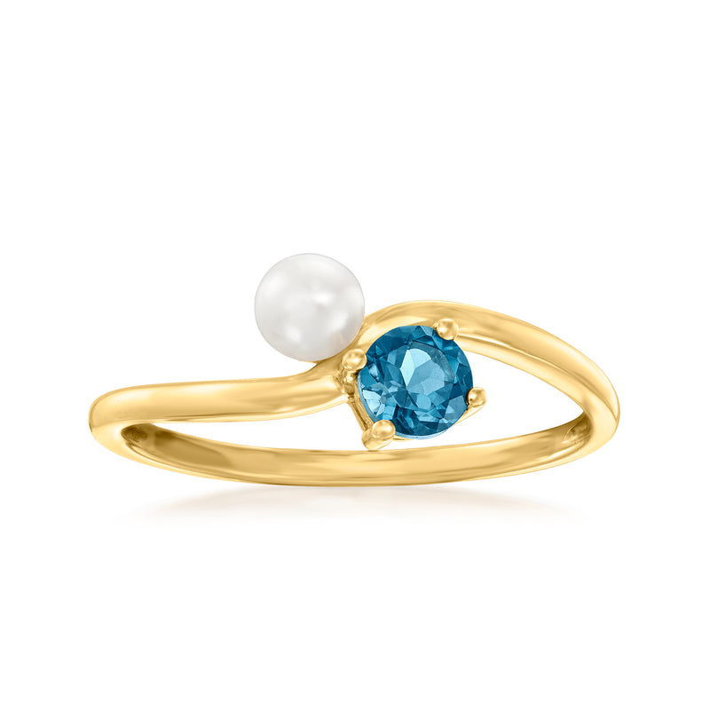 14kt yellow gold ring with blue topaz center and cultured pearl on side