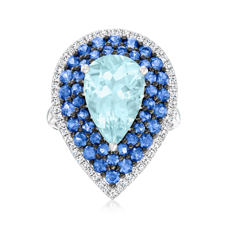 18kt white gold ring with pear aquamarine center, sapphire halo, and diamond border