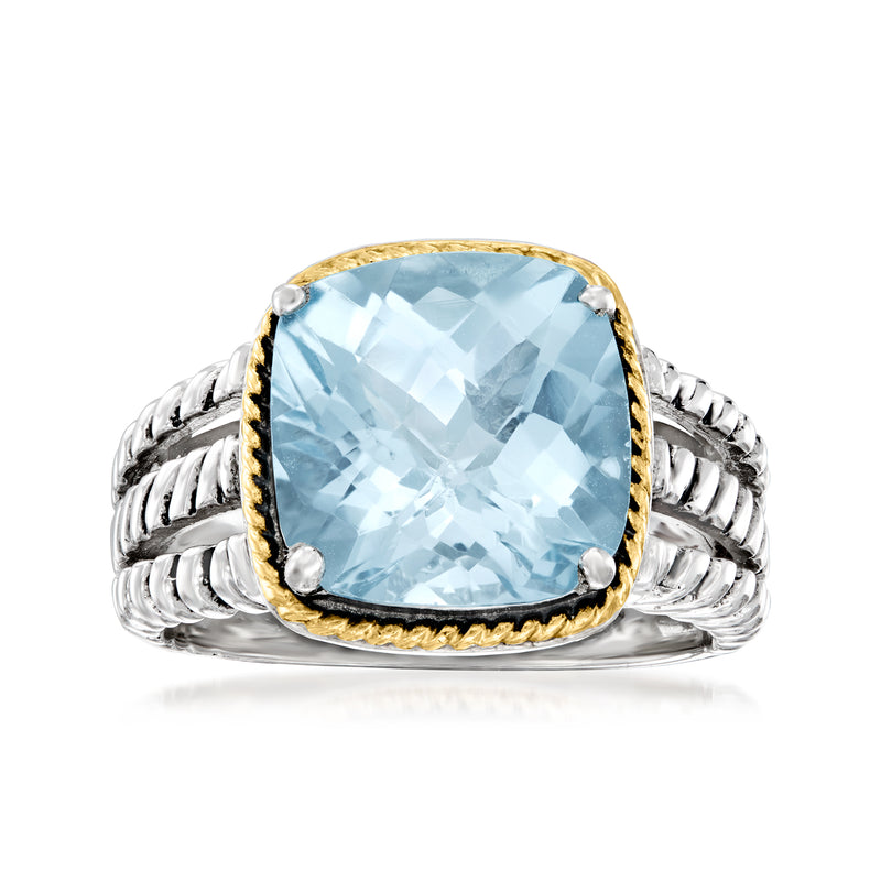 Sky blue topaz oval ring in sterling silver with 14kt yellow gold bezel