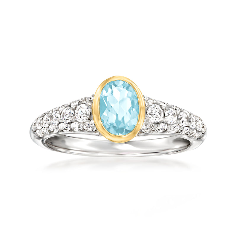 Two-tone sterling silver ring with oval sky blue topaz and pave white topaz accents