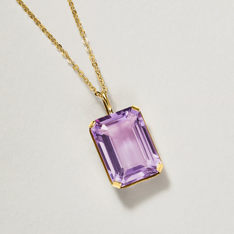 Cushion-cut amethyst purple pendant on 10kt yellow gold chain with gold prongs