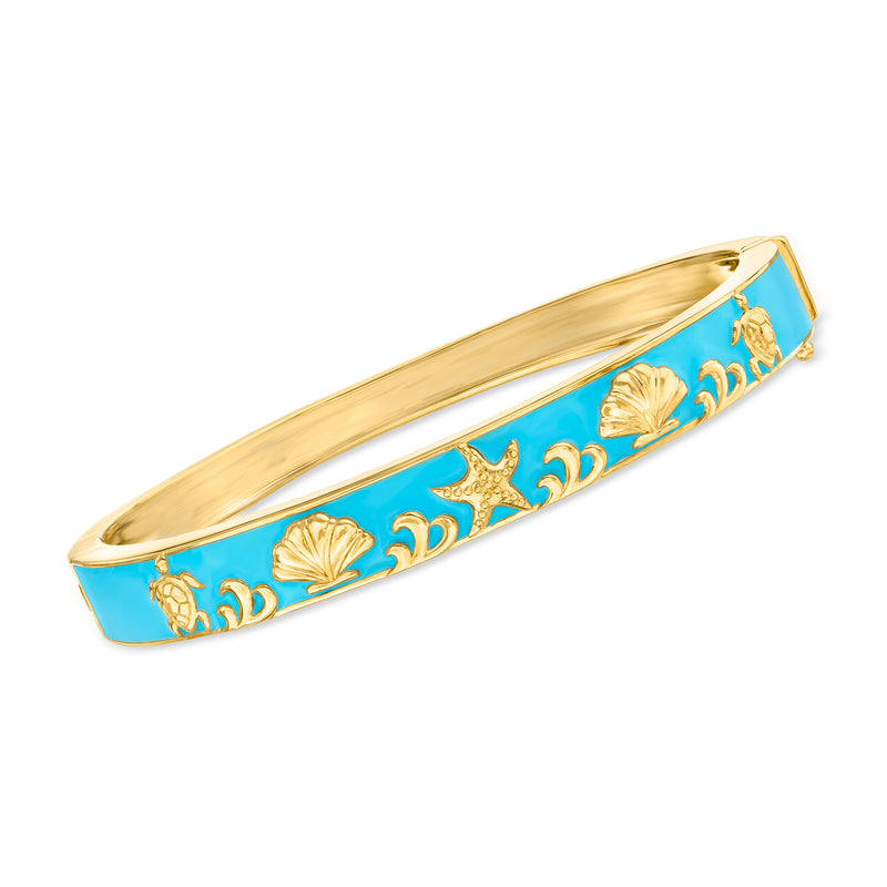 Gold-tone bangle bracelet with blue enamel and shell and wave motifs