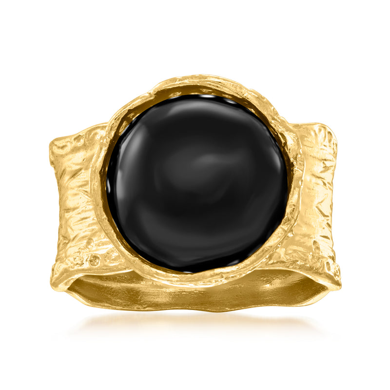 Wide gold-tone ring with black onyx oval cabochon and textured bezel setting