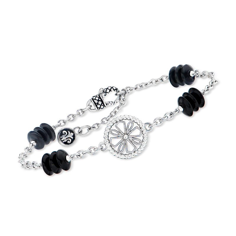 Sterling silver bracelet with black onyx beads and round floral station with diamonds