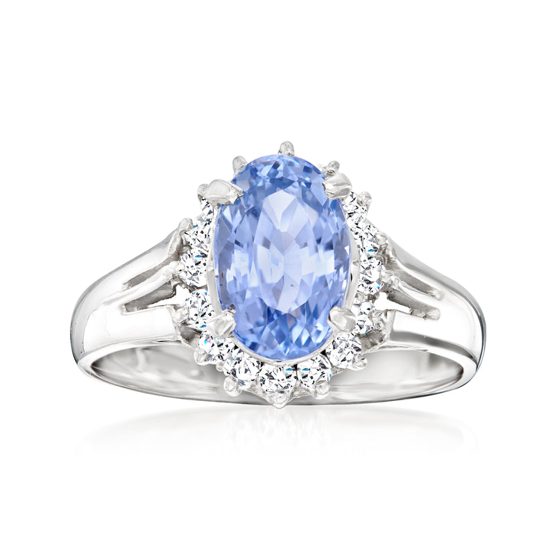 Vintage platinum ring with oval blue sapphire and diamond halo