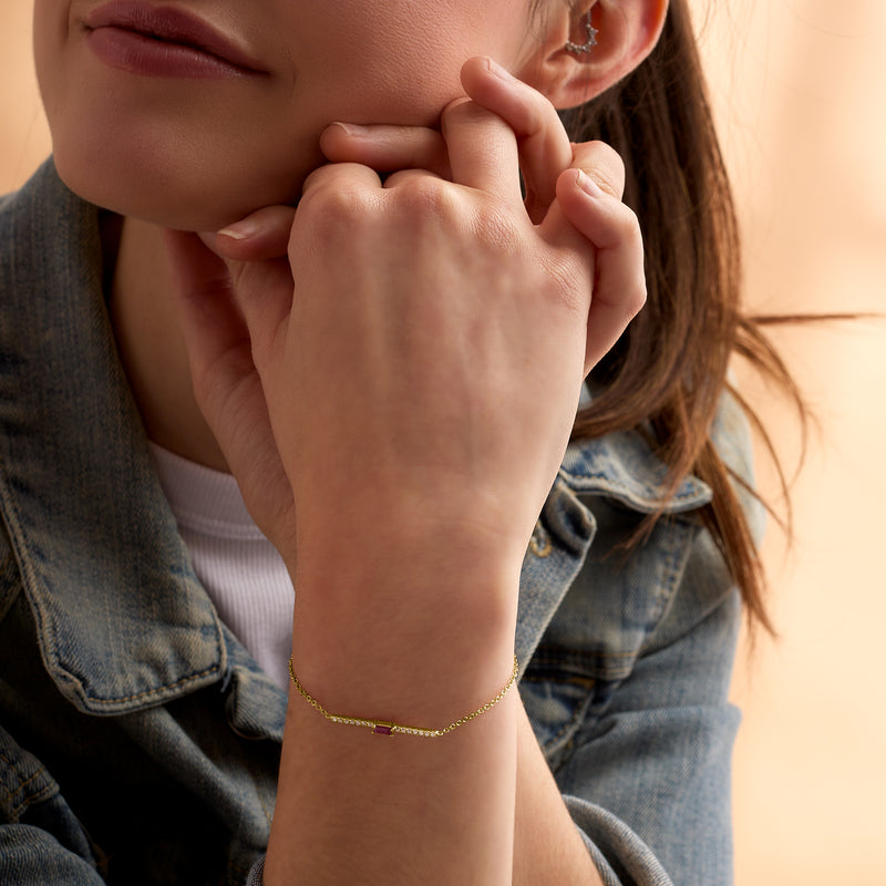 14kt yellow gold bracelet with purple ruby and diamond bar detail