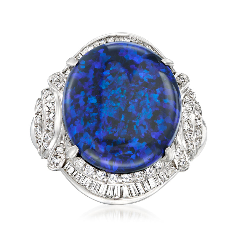 Platinum cocktail ring with large oval dark blue opal and diamond halo and side clusters