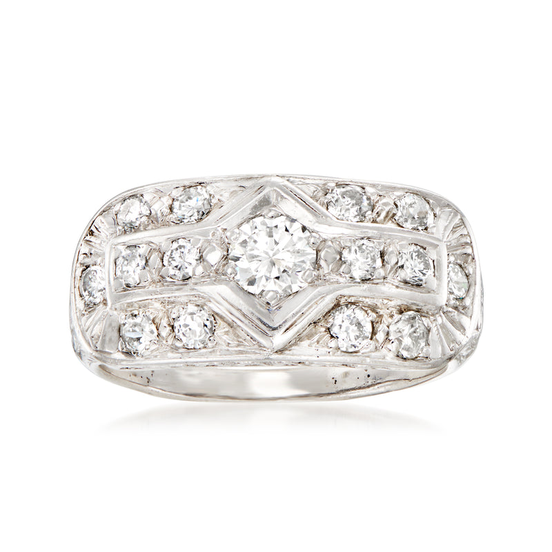 Vintage platinum diamond filigree ring with round and baguette-cut stones, prong-set