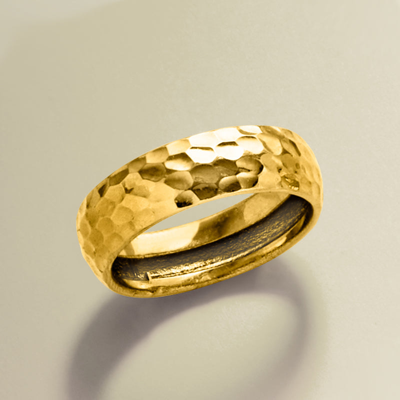 Yellow gold groove-pattern ring, angled view with inner band