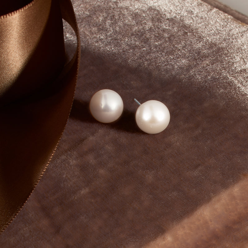 Cultured pearl stud earrings with round white pearls and silver posts