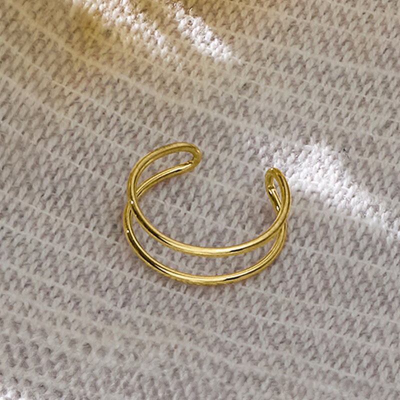 Two-row yellow gold toe ring detail, curved open ends