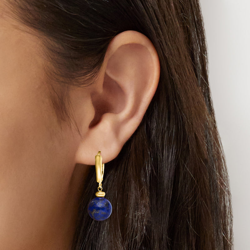 Lapis blue bead drop earring in 10kt yellow gold leverback, worn on ear
