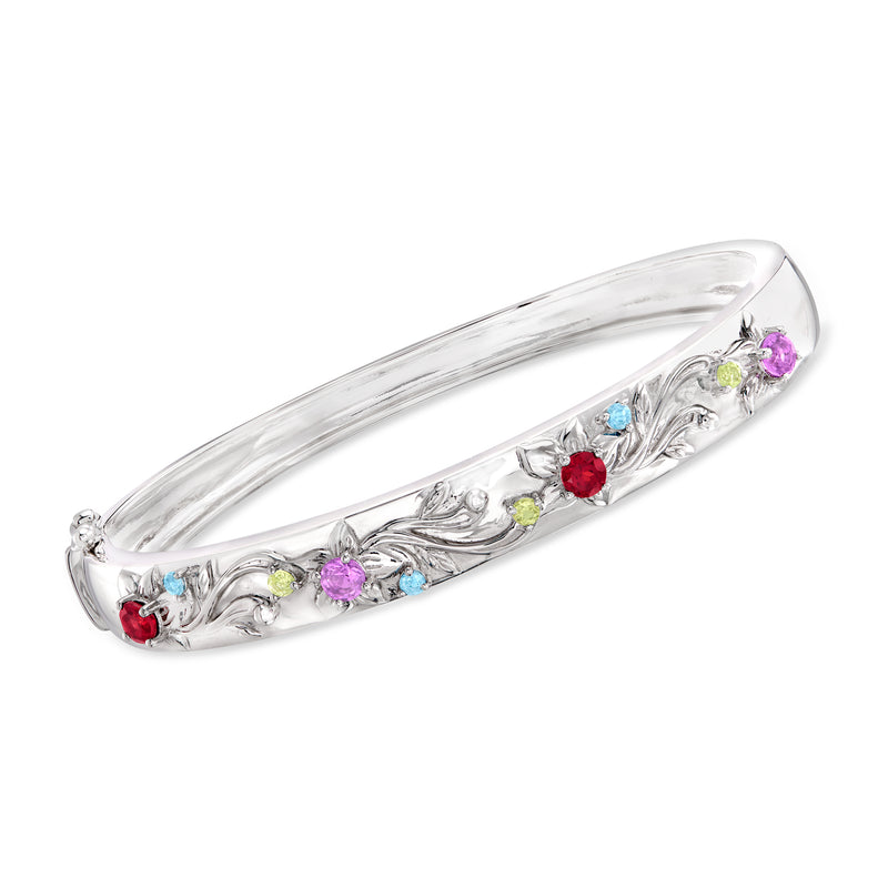 Sterling silver floral bangle bracelet with multi-color gemstone accents along the band