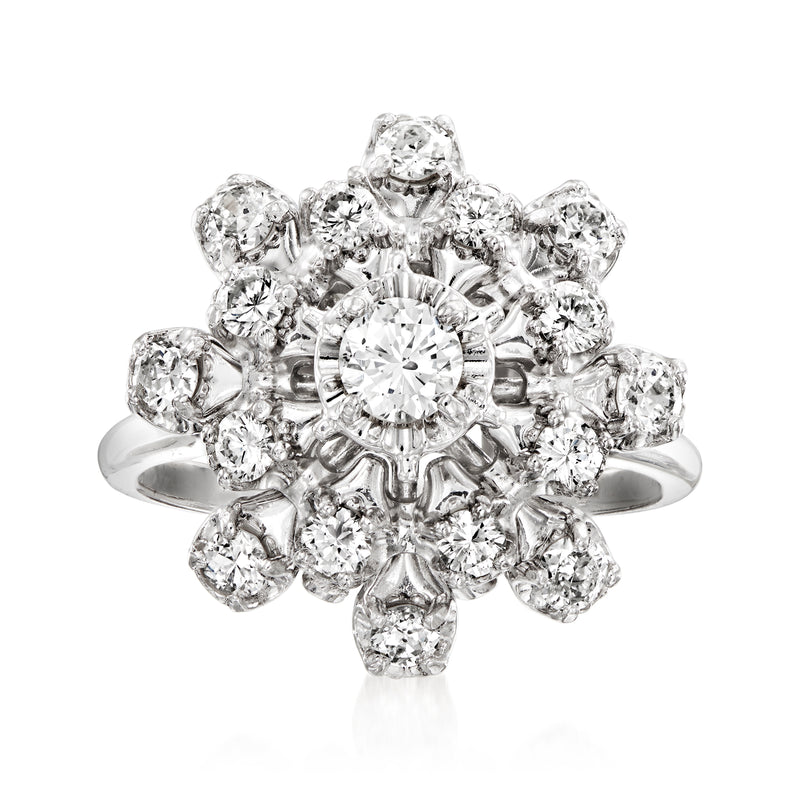 Vintage diamond cluster ring with round center stone and halo in white gold