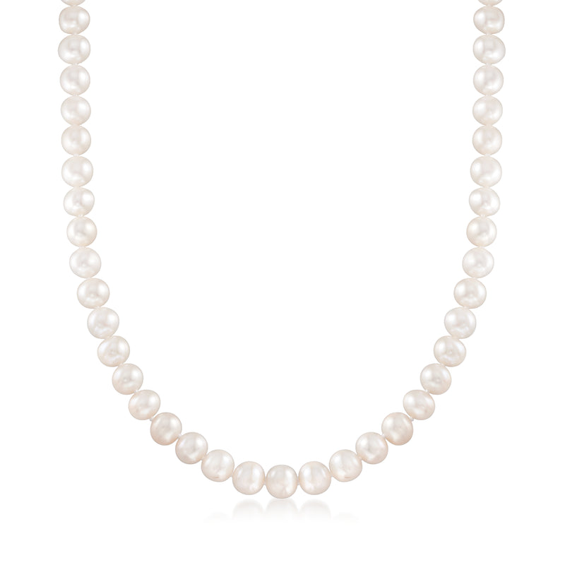Cultured pearl necklace with round white pearls on a string, clasp out of view