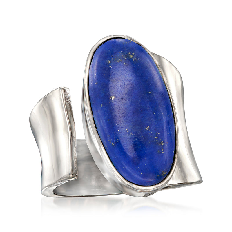Sterling silver wrap ring featuring oval blue lapis stone with raised bezel