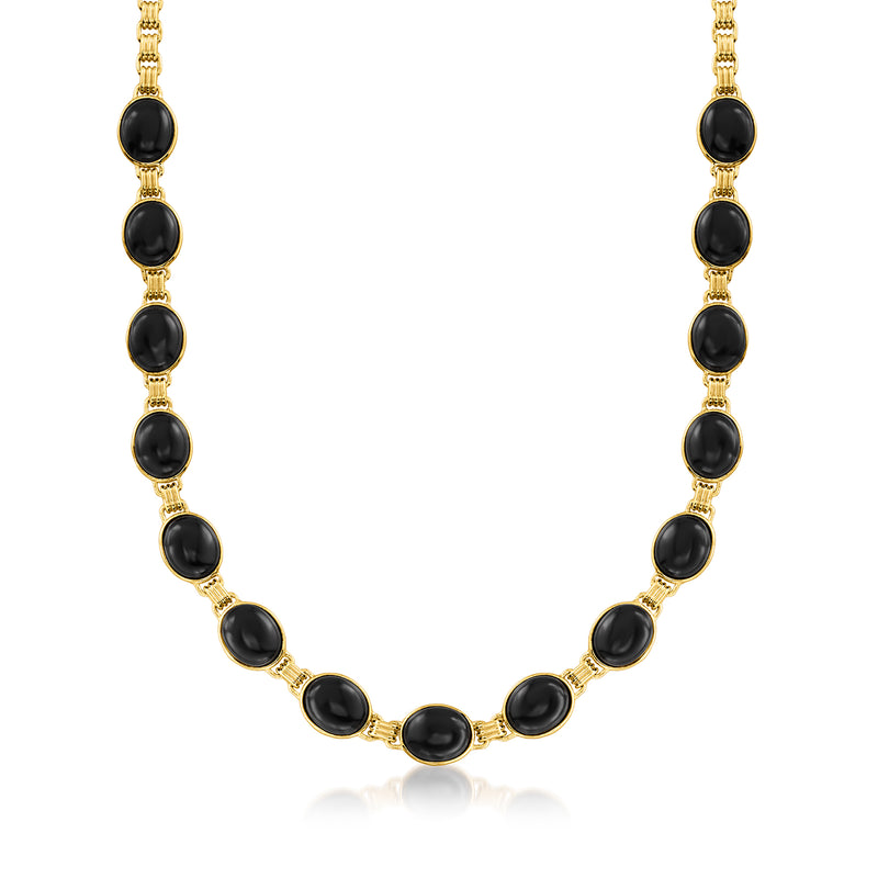 Gold-tone necklace with alternating black oval cabochon beads