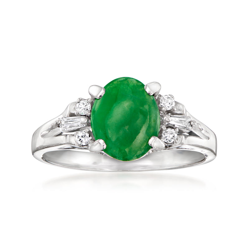 Platinum ring with oval green jade center and four diamond accents