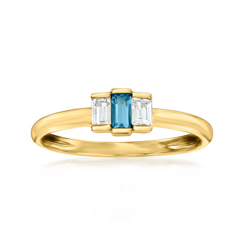 14kt yellow gold ring with blue topaz center and two clear rectangular side stones