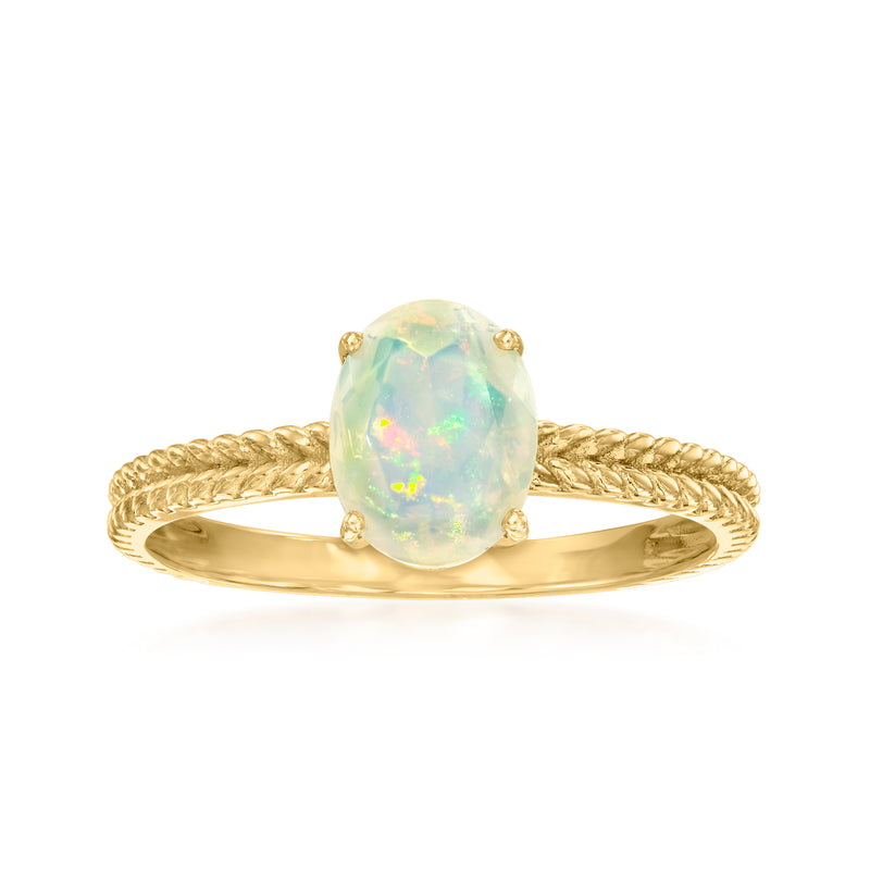 10kt yellow gold twisted ring with oval opal cabochon centerpiece