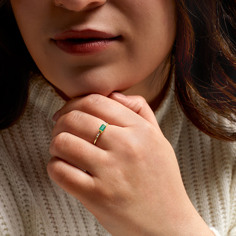 14kt yellow gold ring with emerald green stone and small diamond details