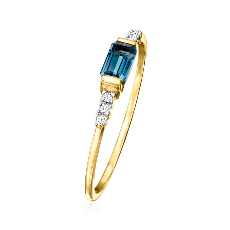14kt yellow gold ring featuring a blue topaz stone with diamond side accents