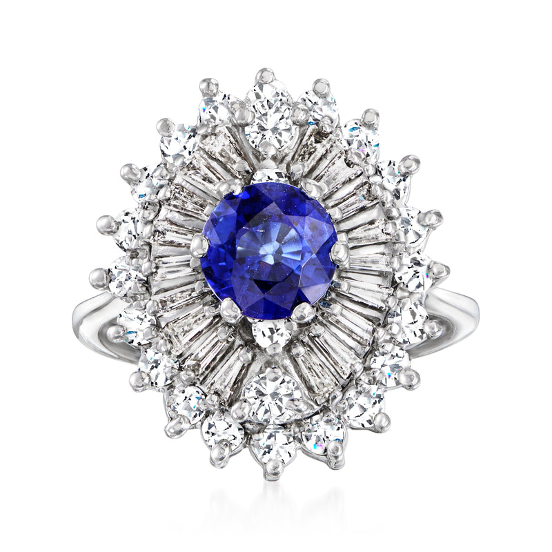 Vintage sapphire and diamond dinner ring in 14kt white gold, blue center with halo.