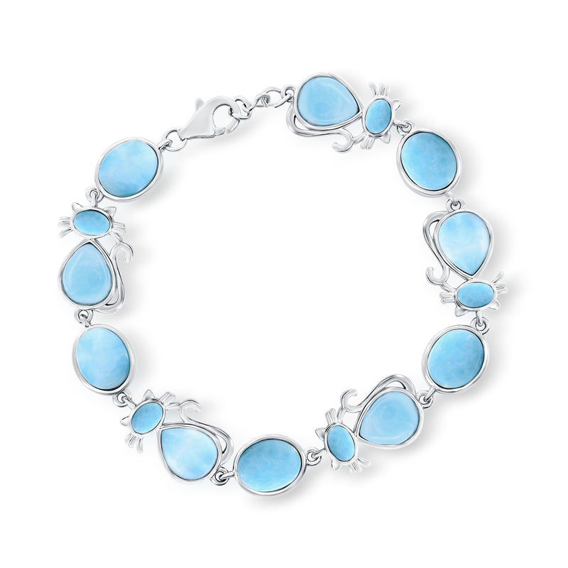 Sterling silver cat bracelet with blue larimar cabochons and curled cat link details