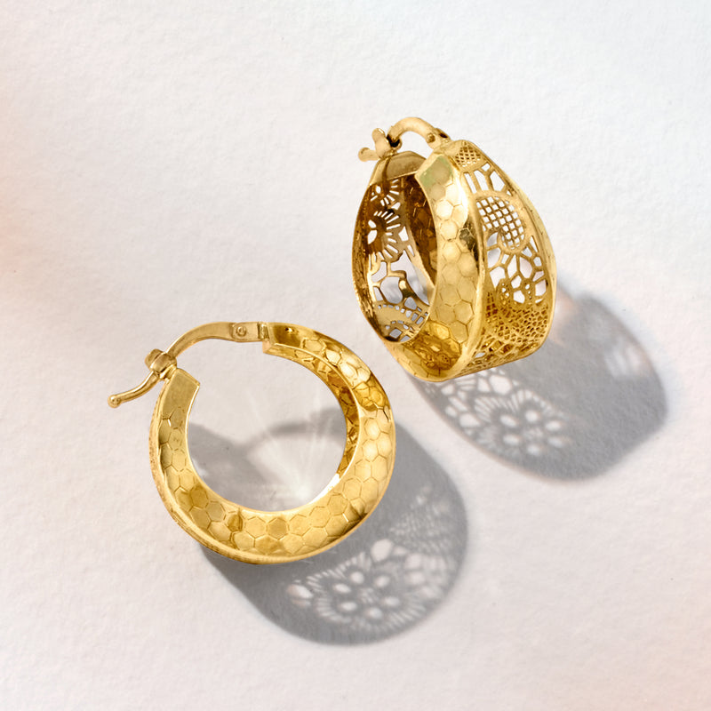 Yellow gold filigree hoop earrings, side view, textured hex pattern