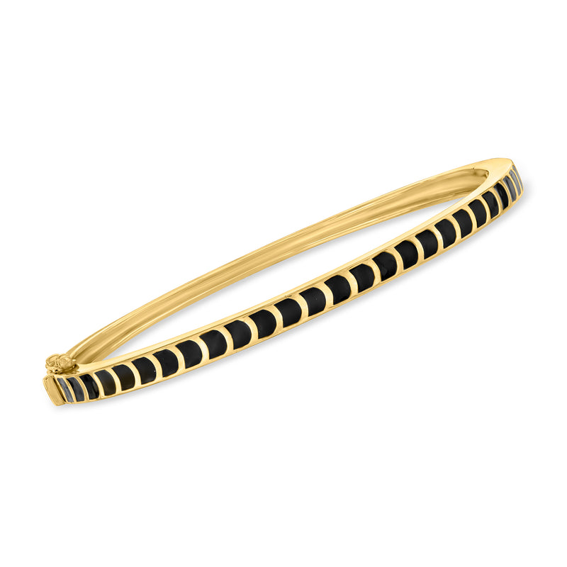 Curved gold bangle bracelet with black enamel station inlays