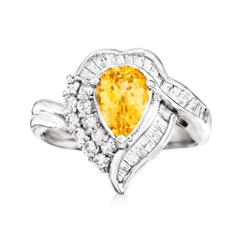 Platinum cocktail ring with oval yellow sapphire and diamond halo accents