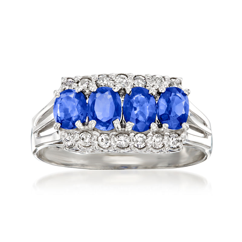 Platinum vintage-style ring with four blue sapphire stones and round diamond accents