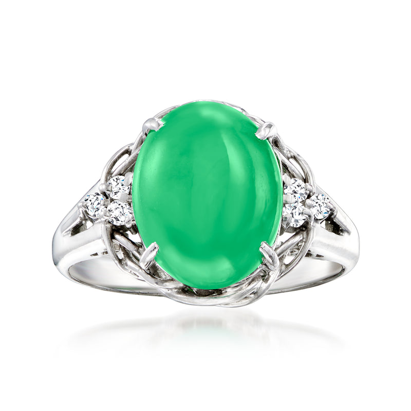 Oval green jade ring with diamond side accents in platinum, vintage-style setting