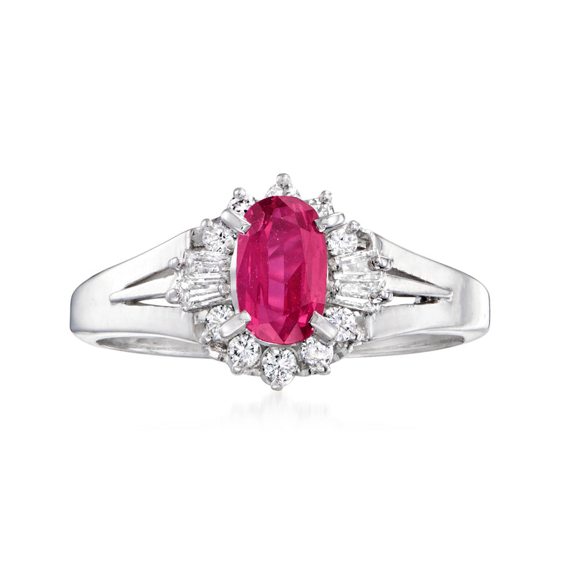 Vintage oval ruby and diamond ring in platinum, with diamond halo and prong-set oval center