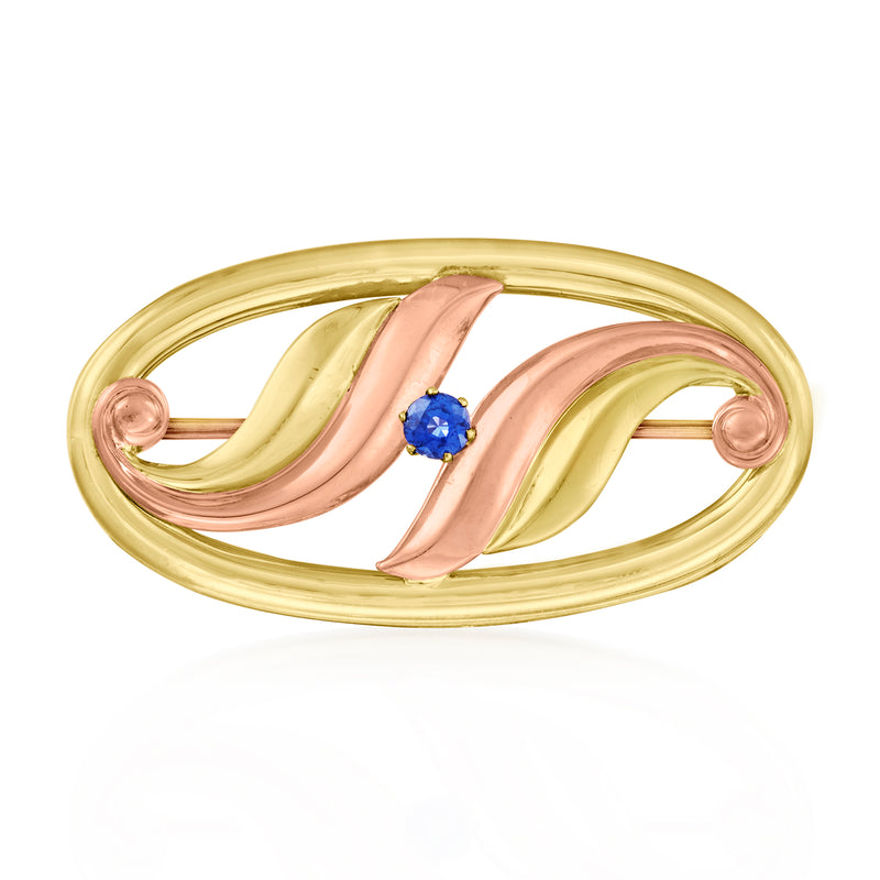 Two-tone gold swirl pin with round blue sapphire center