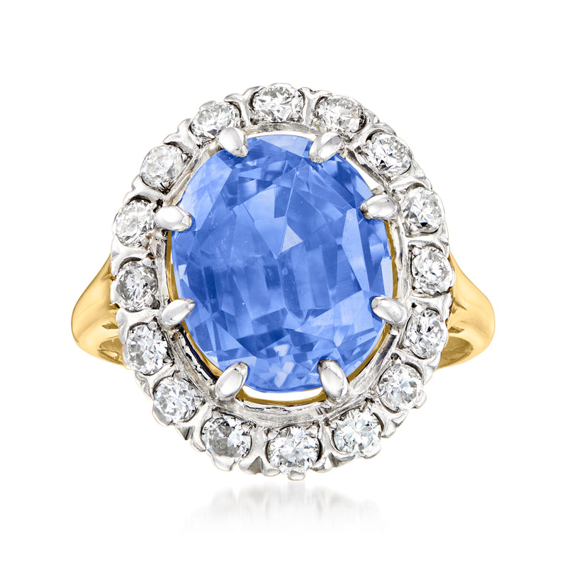 Oval blue sapphire ring with diamond halo, platinum setting and 14kt yellow gold band