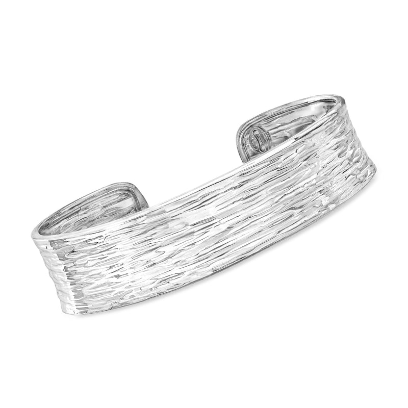 Sterling silver cuff bracelet with textured and polished diagonal stripe pattern