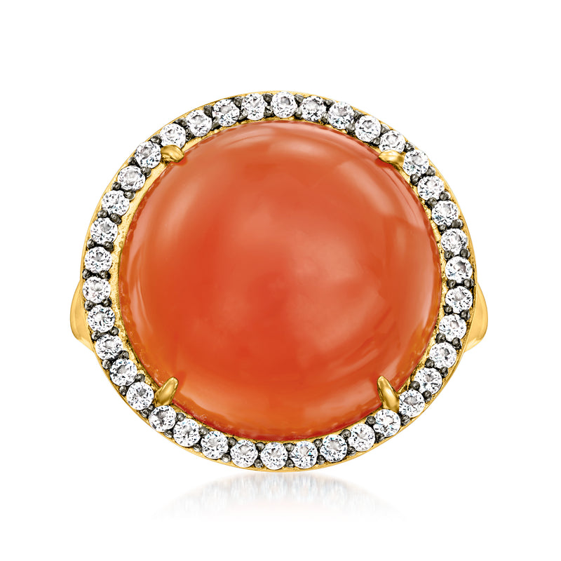 Gold over sterling ring with orange oval center and white stone halo