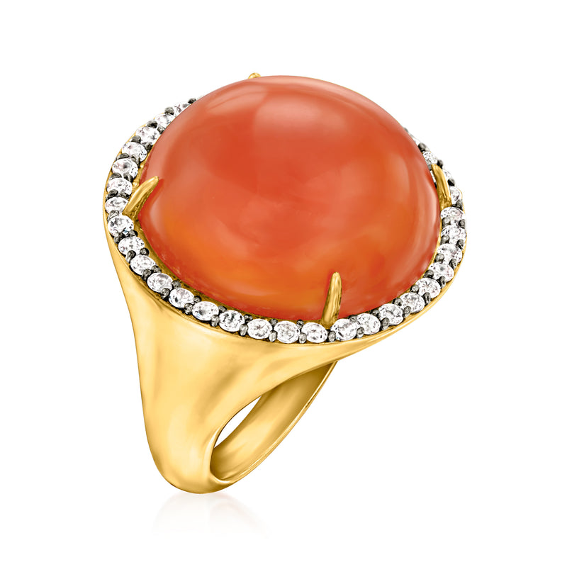 Gold over sterling ring with orange oval center, white pave halo, open shank